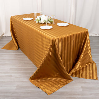 Create a Stunning Ambiance with the 90"x132" Gold Satin Stripe Seamless Rectangular Tablecloth
