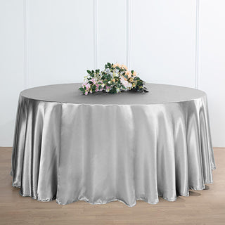 Elevate Your Event with the 120" Silver Seamless Satin Round Tablecloth
