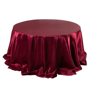 132" Burgundy Seamless Satin Round Tablecloth for 6 Foot Table With Floor-Length Drop