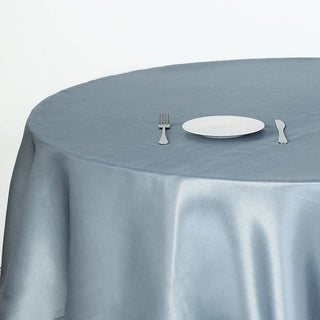 Create a Stunning Table Setting with the Dusty Blue Seamless Satin Round Tablecloth