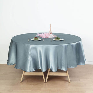 Elevate Your Event with the Dusty Blue Seamless Satin Round Tablecloth