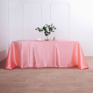 Add a Pop of Elegance to Your Event with the Coral Red Satin Tablecloth