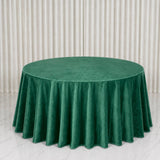 Green round velvet tablecloth on elegant banquet table