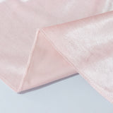 Light pink sheer mesh fabric close-up with soft texture and hem stitching