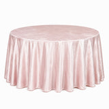 Round blush pink velvet tablecloth draped over a banquet table