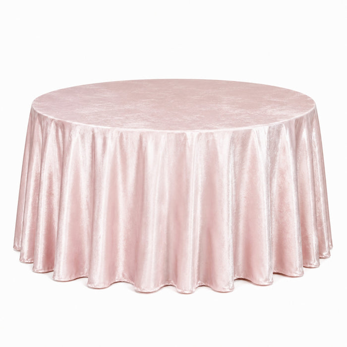 Round blush pink velvet tablecloth draped over a banquet table