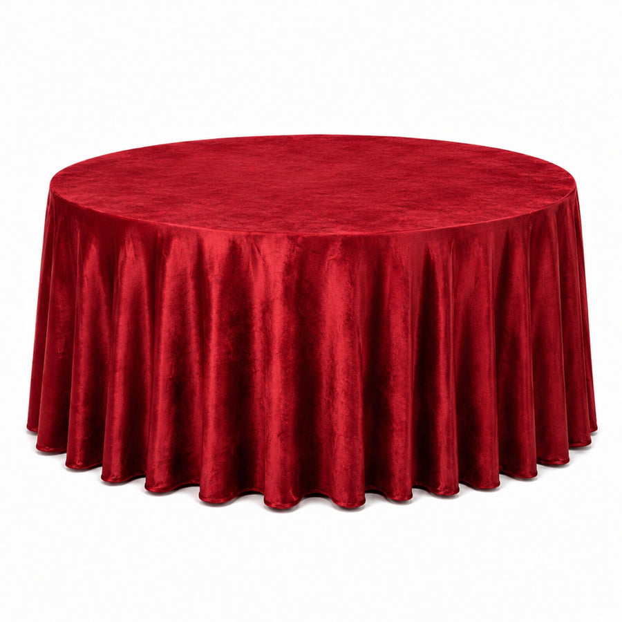 Round red velvet tablecloth on a banquet table, elegant event decor