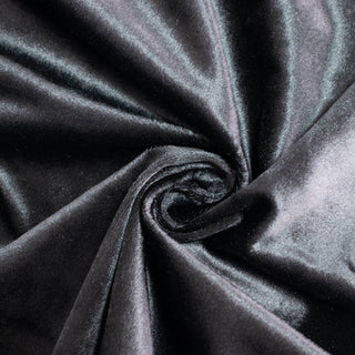 Glossy black satin fabric swirl with elegant folds#whtbkgd