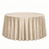 Round champagne velvet tablecloth on a banquet table, elegant event decor