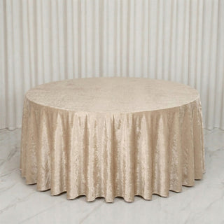 Champagne round velvet tablecloth on elegant draped backdrop