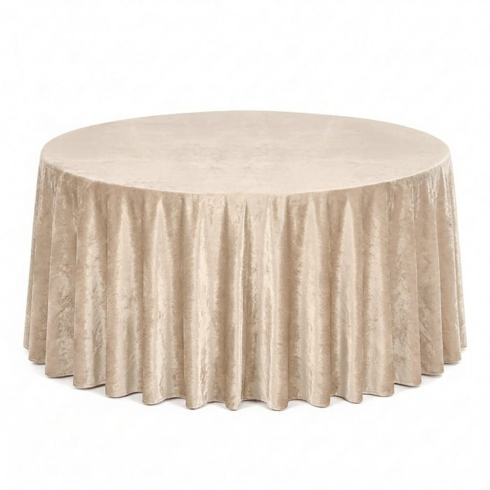 Round beige velvet tablecloth with floor-length drape on banquet table
