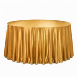Gold round table with satin tablecloth on white background