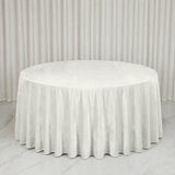 Round white tablecloth draped on a banquet table with matching backdrop