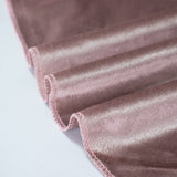 Pink velvet fabric close-up with soft ruffled edges
