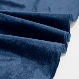 Blue velvet fabric folds with soft plush texture on white background