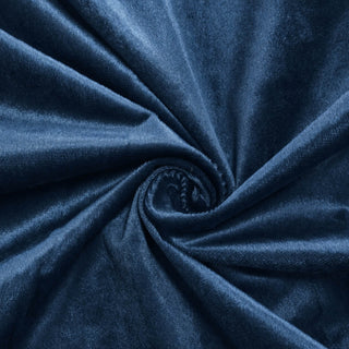 Dark blue velvet fabric swirls close-up with soft textured folds#whtbkgd