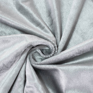 Close-up of shiny silver satin fabric with a spiral swirl pattern#whtbkgd