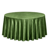 Green round velvet tablecloth on a table