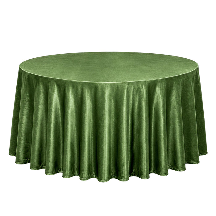 Green round velvet tablecloth on a table
