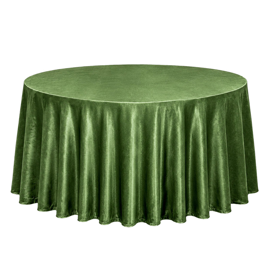 Green round velvet tablecloth on a table