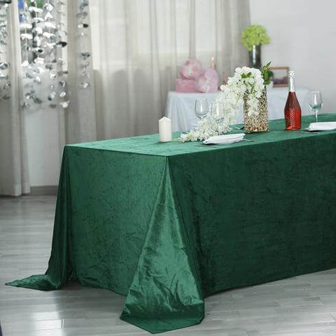 Emerald green velvet tablecloth on a dining table