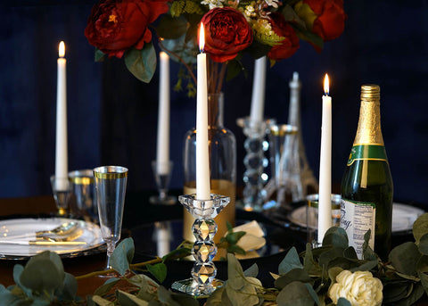 Romantic table setting with floral centerpiece and champagne bottle