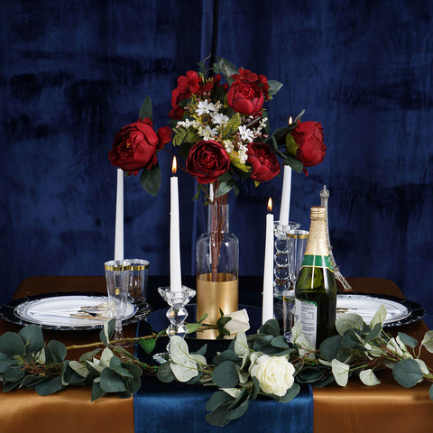 Table with navy chair and lace veil draped over the back