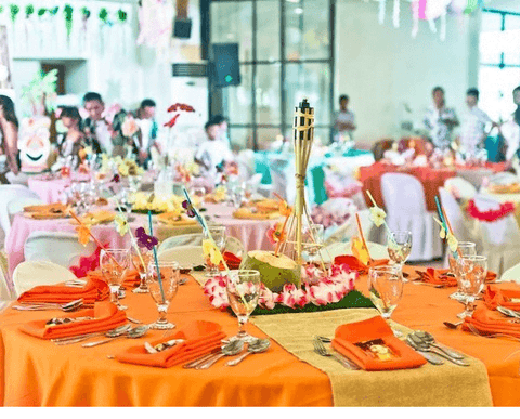 Orange and gold decorated banquet table