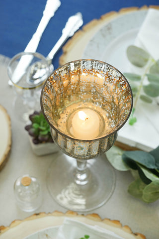 Mercury glass candle holder with lit candle