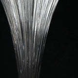 Close-up of a crystal trophy with vertical glass ridges on black background