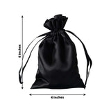 Black satin drawstring bag, 6 inches by 4 inches, isolated on white background.