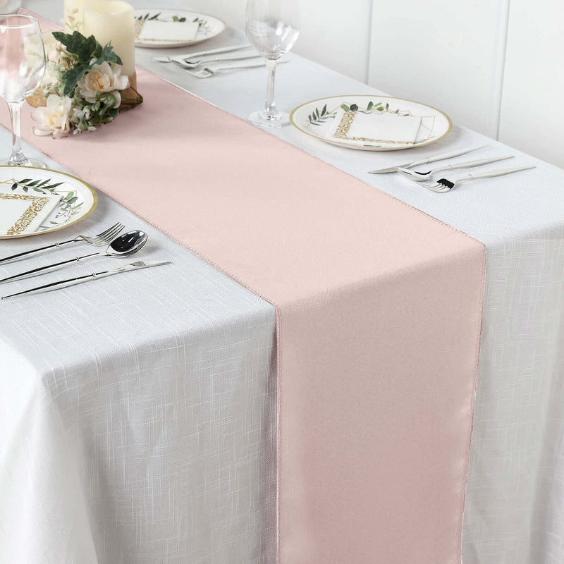 Blush table runner on a white table setting