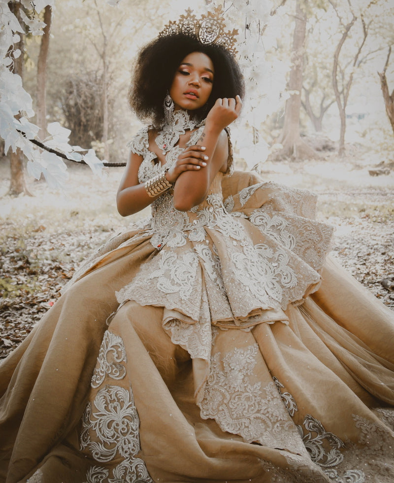 Bride in a lace and burlap gown outdoors