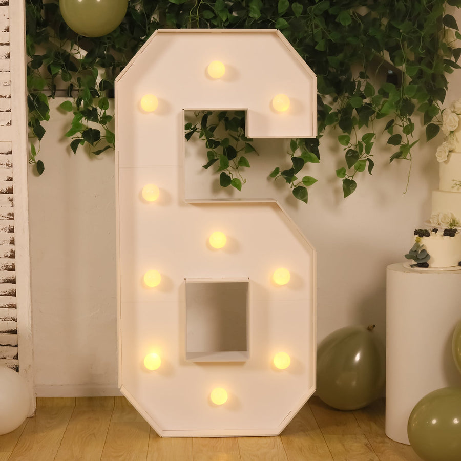 Large illuminated number 6 decoration with lights, ideal for events and celebrations.