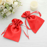 Red satin drawstring bags for gifts or party favors.
