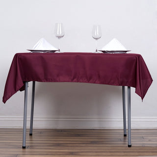 Add Elegance to Your Event with the 54x54 Burgundy Square Seamless Polyester Tablecloth