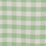 Green and white gingham tablecloth on a table. #whtbkgd
