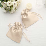 Two elegant satin drawstring bags in soft beige on a light background.