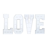 White marquee letters spelling LOVE with built-in lights on a white background#whtbkgd