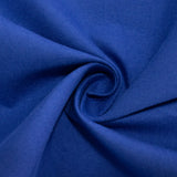 Blue tablecloth with a white plate and silver utensils on a table #whtbkgd