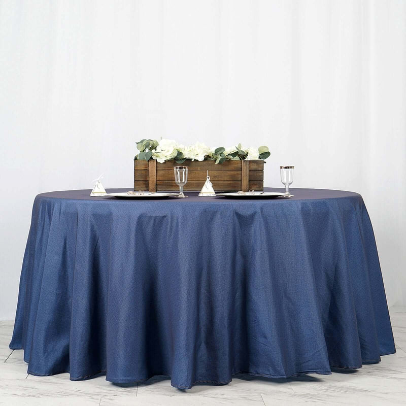 Dark blue satin tablecloth on a round table