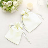Elegant satin drawstring bags in cream color, perfect for weddings or special events.
