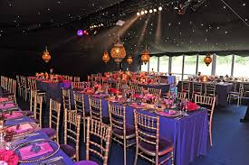 Reception tables set under string lights
