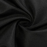 Black tablecloth draped over a folding table. #whtbkgd
