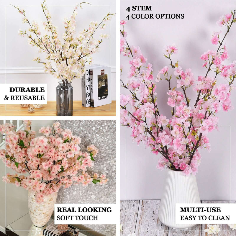 Pink cherry blossom stems in a white vase