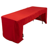 Red table cover draped over a folding table for events or displays 