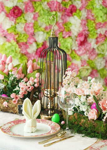 Easter table centerpiece with lantern and floral arrangement