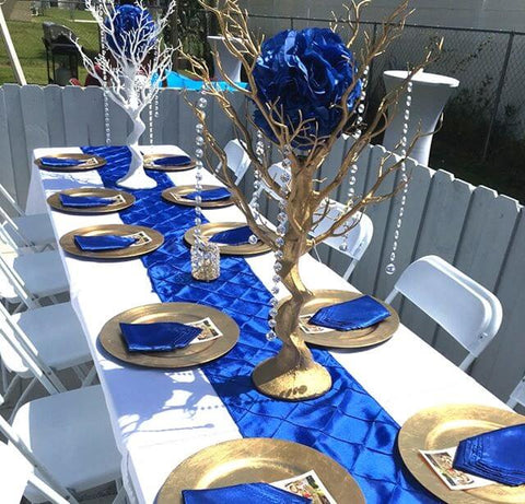 Blue and gold table centerpiece with a decorative tree