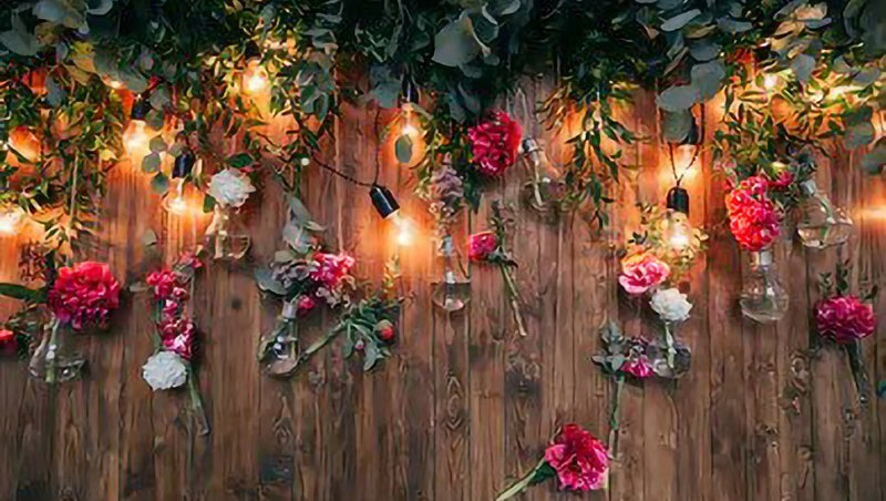Greenery wreaths on a rustic wall display