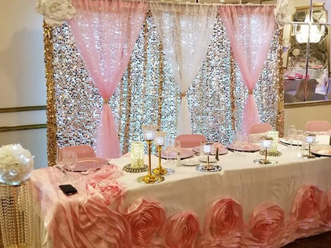 Pink-and-white dessert table with sequin backdrop